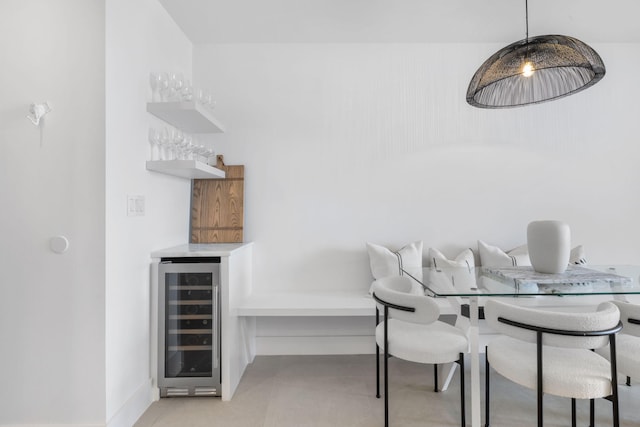 dining area with bar area and beverage cooler