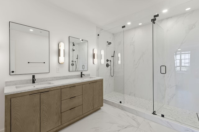 bathroom featuring vanity and a shower with shower door