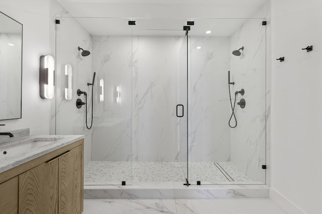 bathroom featuring walk in shower and vanity