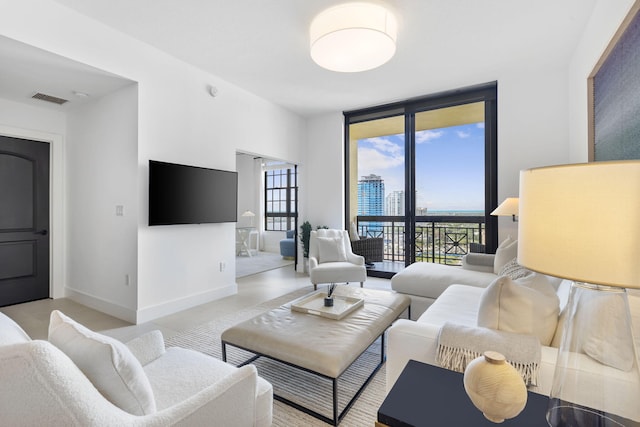 living room with floor to ceiling windows