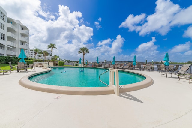 view of swimming pool featuring a patio area