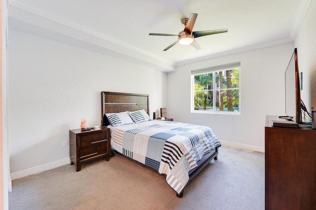 bedroom featuring carpet, ornamental molding, and ceiling fan