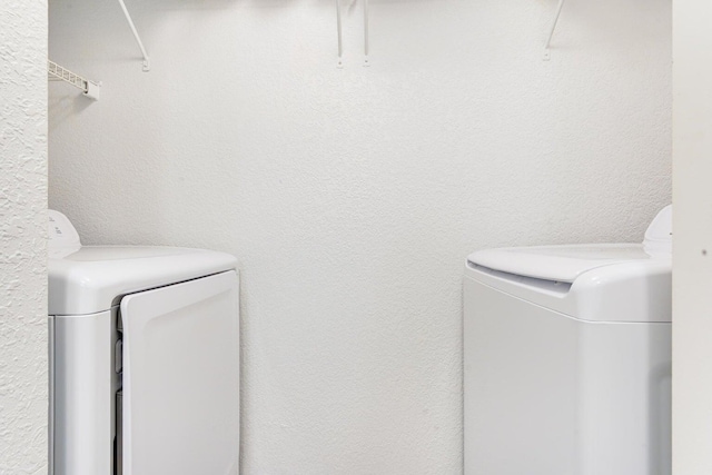 laundry room featuring washer and clothes dryer