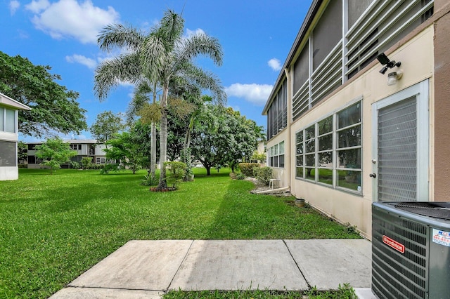 view of yard featuring central AC unit