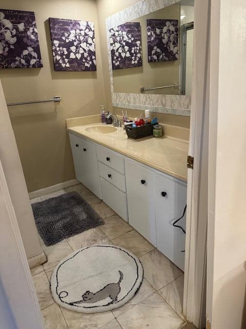 bathroom featuring tile patterned floors and vanity