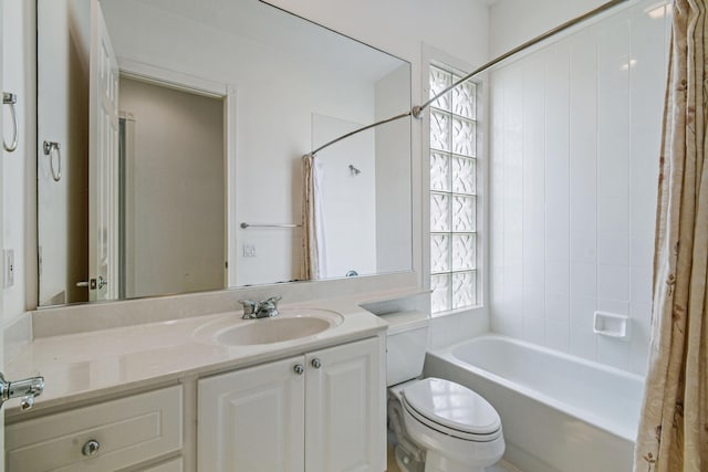 full bathroom with shower / tub combo, vanity, and toilet