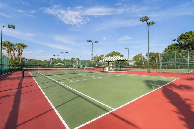 view of sport court with a gazebo and basketball hoop