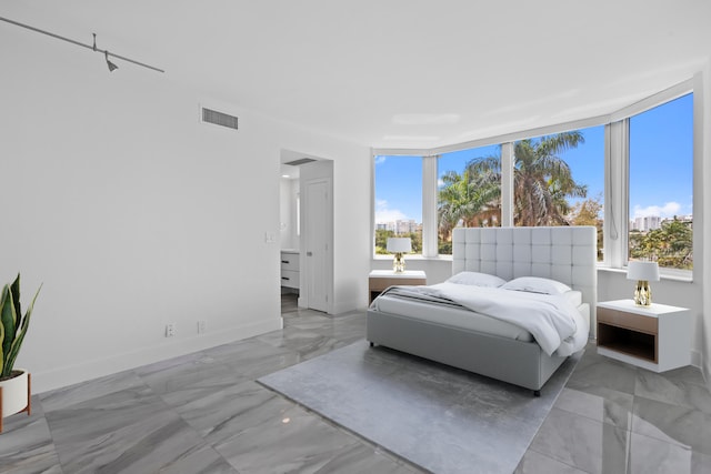 tiled bedroom with multiple windows