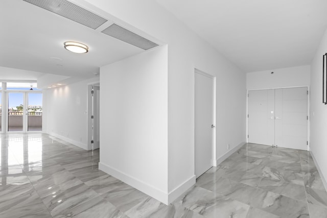 300 SE 5th Ave Unit 5180, Boca Raton, FL 33432 - hall with light marble finish floors and baseboards