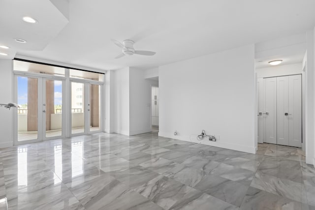 300 SE 5th Ave Unit 5180, Boca Raton, FL 33432 - spare room featuring light marble finish flooring, a ceiling fan, recessed lighting, and baseboards
