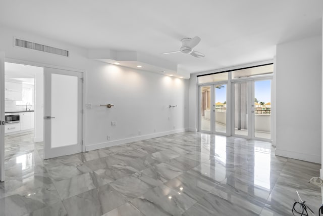 300 SE 5th Ave Unit 5180, Boca Raton, FL 33432 - empty room with french doors, a ceiling fan, light marble finish flooring, a sink, and baseboards
