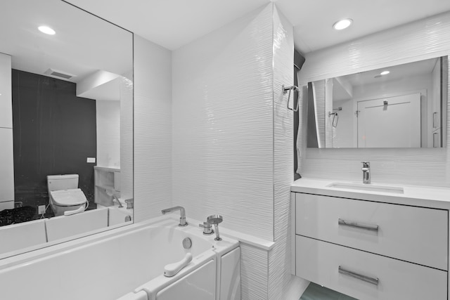300 SE 5th Ave Unit 5180, Boca Raton, FL 33432 - bathroom with a garden tub, toilet, vanity, and recessed lighting
