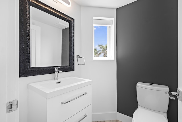 300 SE 5th Ave Unit 5180, Boca Raton, FL 33432 - half bathroom with toilet, vanity, and baseboards