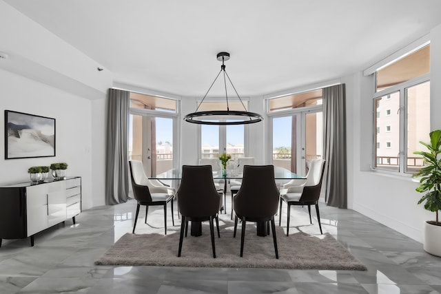 dining area featuring tile patterned floors and french doors