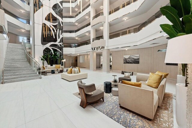 300 SE 5th Ave Unit 5180, Boca Raton, FL 33432 - lobby featuring a high ceiling, stairway, and wood walls