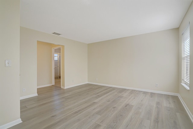 spare room with light hardwood / wood-style floors