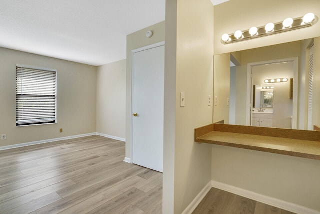 bathroom with wood-type flooring