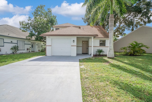 view of front of property featuring a garage and a front yard