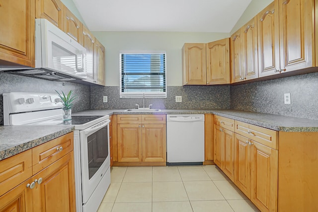 kitchen with lofted ceiling, sink, tasteful backsplash, light tile patterned flooring, and white appliances