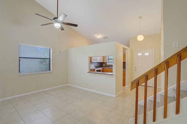 interior space with ceiling fan and high vaulted ceiling