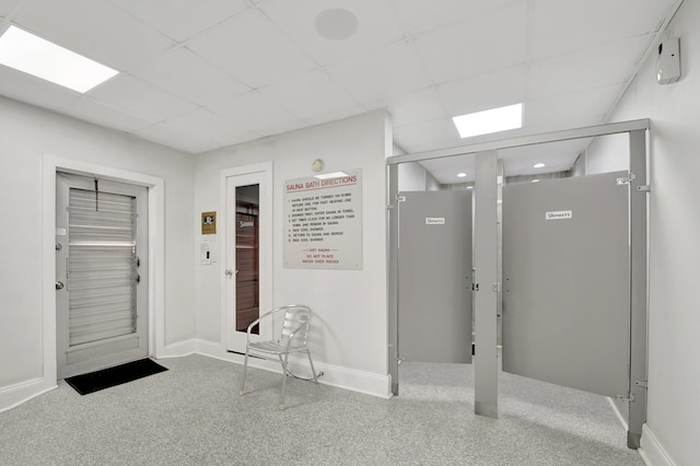 corridor featuring a paneled ceiling