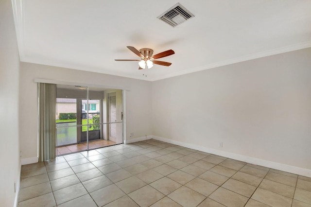 tiled spare room featuring ceiling fan and ornamental molding