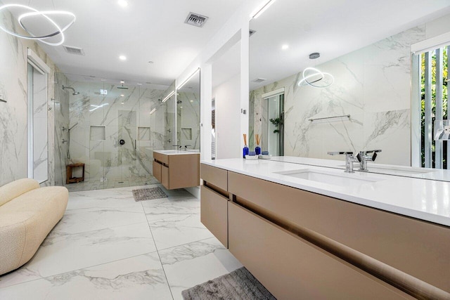 bathroom with stone wall, recessed lighting, visible vents, marble finish floor, and a marble finish shower