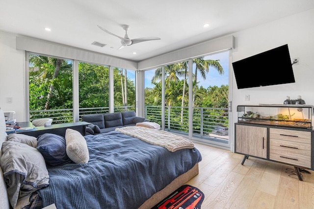 bedroom with access to exterior, ceiling fan, and light hardwood / wood-style flooring