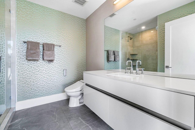 full bath with visible vents, a shower stall, toilet, and vanity