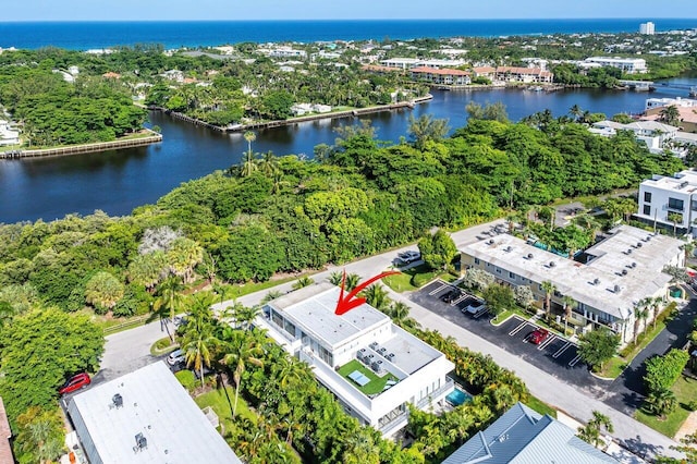 birds eye view of property featuring a water view