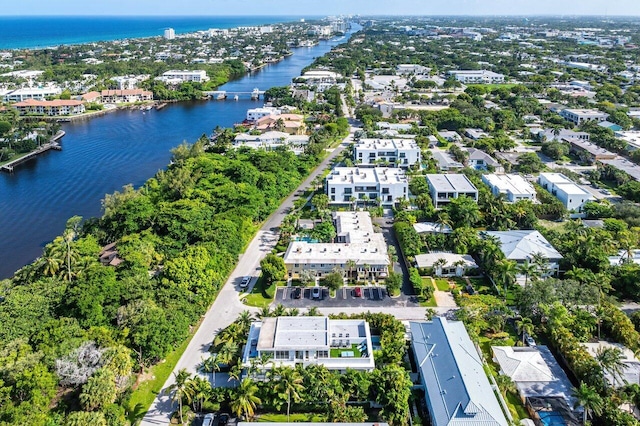 bird's eye view featuring a water view and a residential view