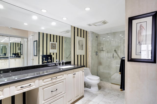 bathroom featuring vanity, walk in shower, tile patterned flooring, and toilet