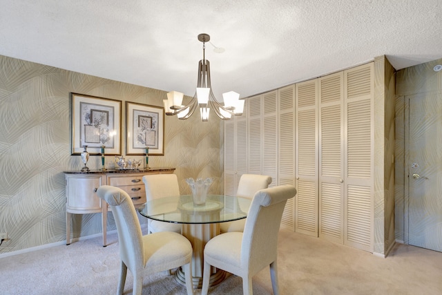 dining space featuring light carpet, a textured ceiling, and a chandelier