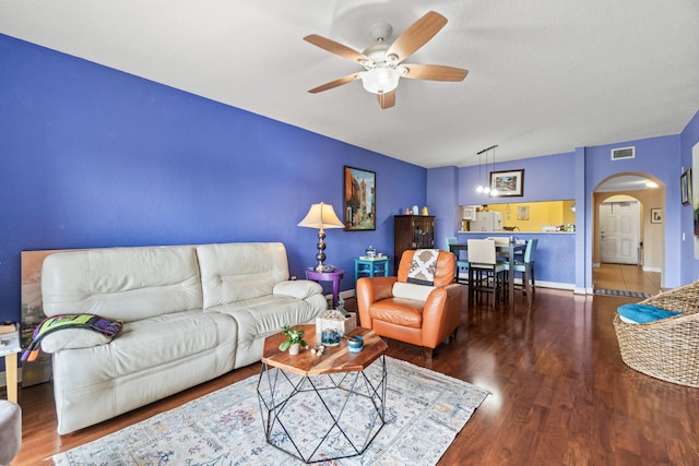 living room with ceiling fan and hardwood / wood-style floors