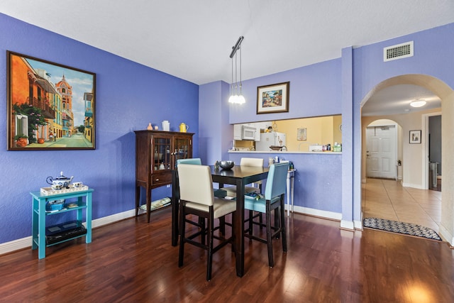 dining space featuring hardwood / wood-style floors