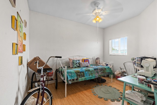 bedroom featuring light hardwood / wood-style floors and ceiling fan