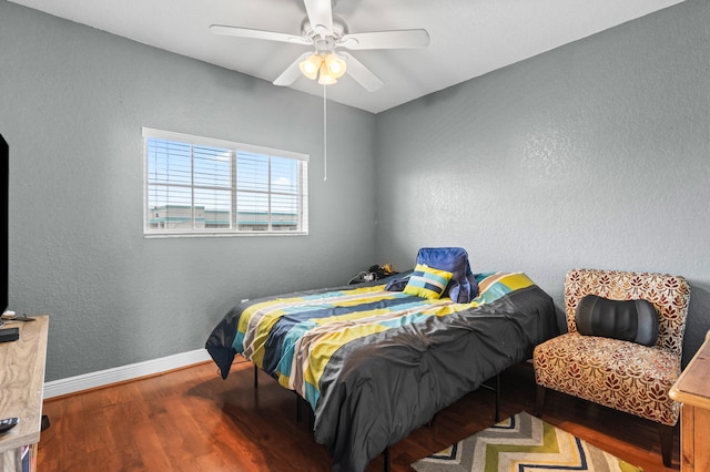 bedroom with hardwood / wood-style flooring and ceiling fan