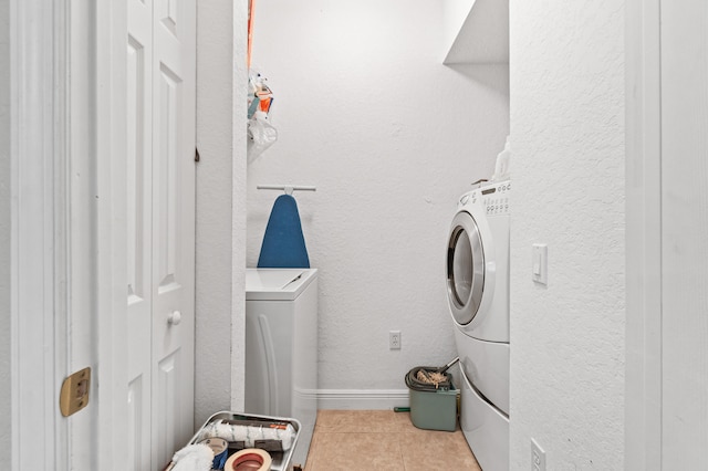 washroom with washer / clothes dryer and tile patterned flooring