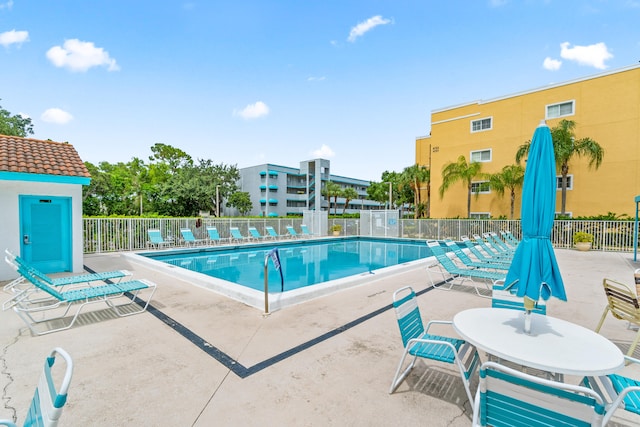 view of swimming pool featuring a patio area