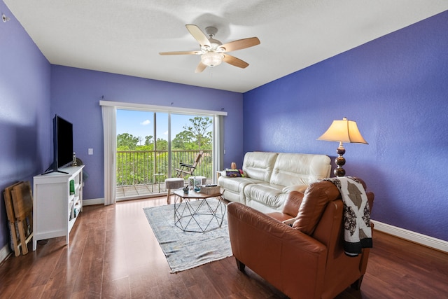 living room featuring ceiling fan and hardwood / wood-style floors