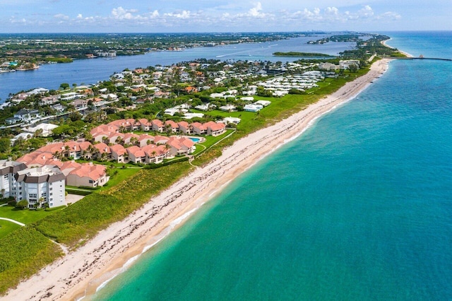 bird's eye view with a water view and a view of the beach