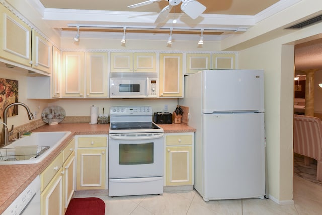 kitchen with light countertops, visible vents, light tile patterned flooring, a sink, and white appliances