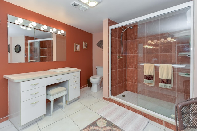 bathroom with walk in shower, tile patterned floors, toilet, and vanity