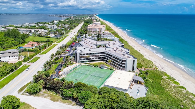 birds eye view of property featuring a water view and a view of the beach