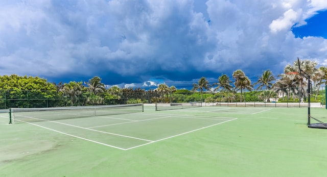 view of sport court featuring fence