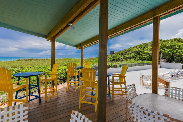 wooden deck featuring a water view