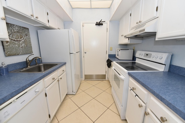 kitchen featuring white appliances, white cabinets, under cabinet range hood, a sink, and light tile patterned flooring