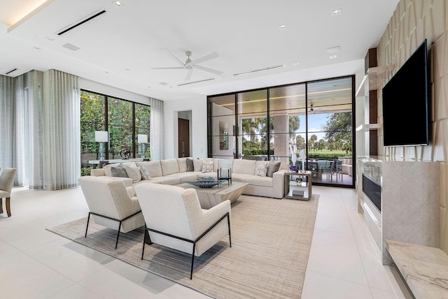 tiled living room with ceiling fan