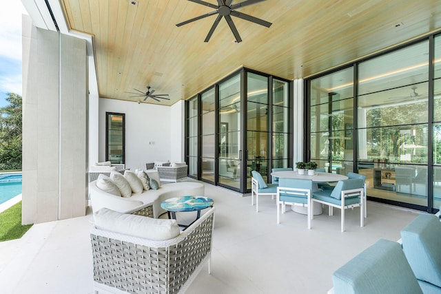 view of patio / terrace with an outdoor living space and ceiling fan