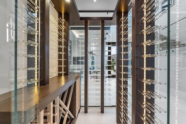 wine area featuring tile patterned floors